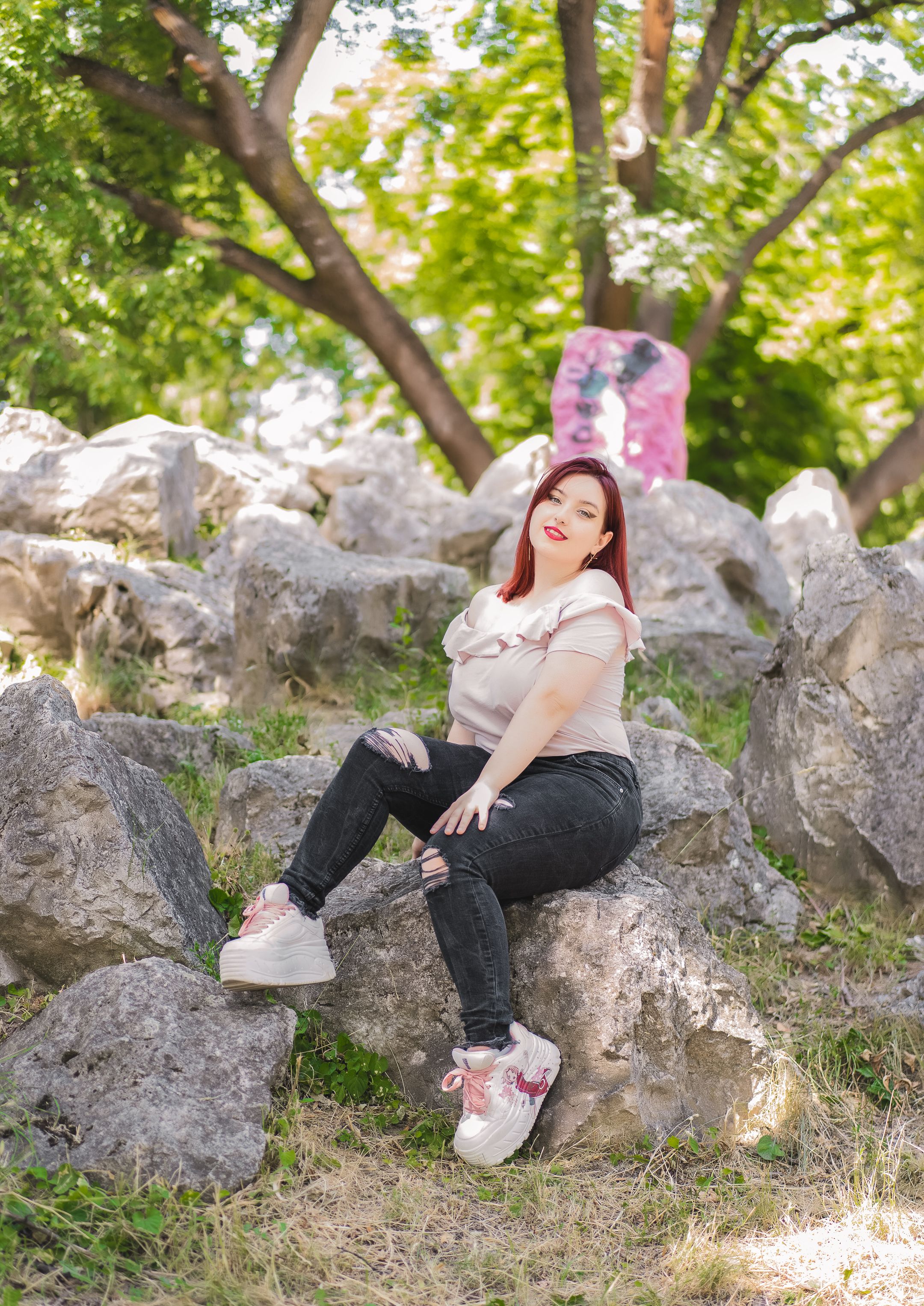 Woman Sitting on a Rock · Free Stock Photo