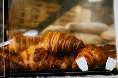 Free Croissants on Clear Glass Display Counter Stock Photo