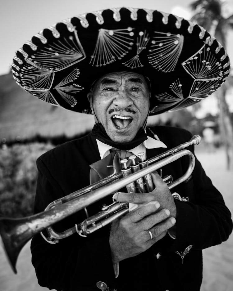 Happy Mariachi Man Holding A Trumpet