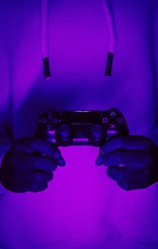 Hands holding a wireless game controller under neon lights, creating a vibrant gaming vibe.