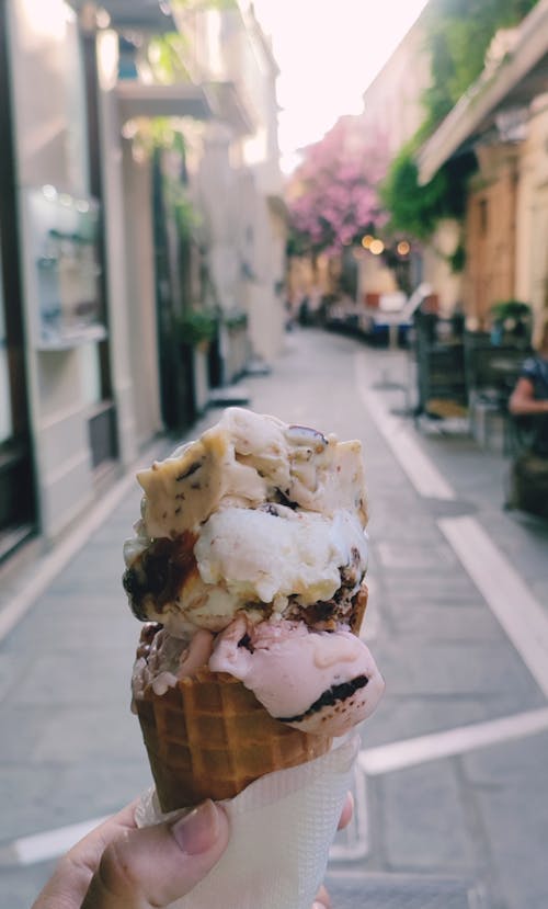 Close-up of Holding Ice Cream on a Street