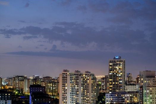 Captivating evening view of Istanbul's modern cityscape with tall buildings and a scenic sky.