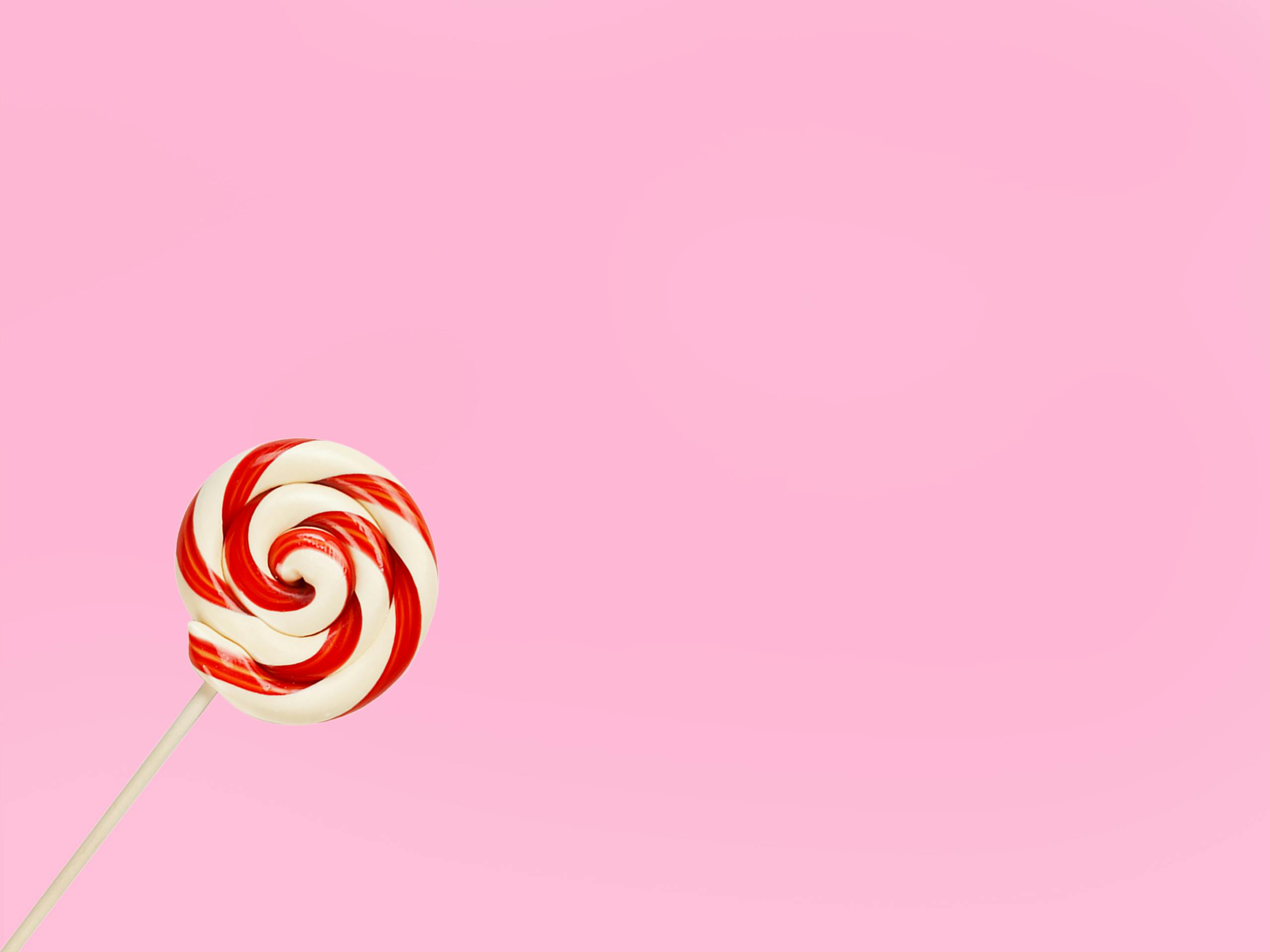 Colorful Chocolate Candies And Lollipop On Pink Pastel Background  Lizenzfreie Fotos Bilder und Stock Fotografie Image 99578872