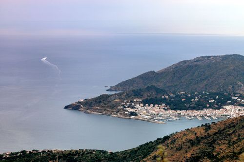 Free A stunning aerial view of a coastal town in Spain, showcasing its harbor and surrounding mountains. Stock Photo