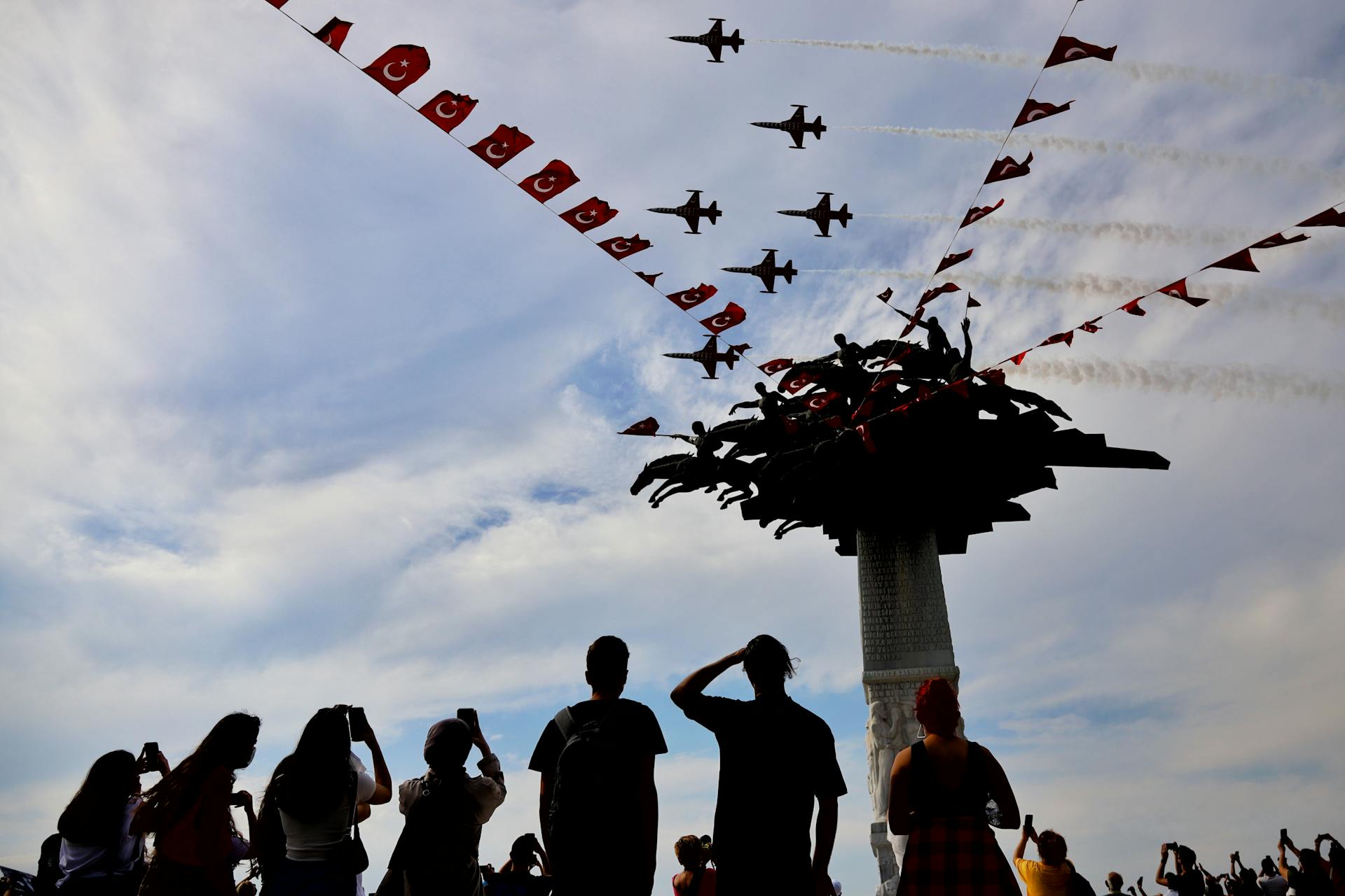 Military Airplanes Flying over Monument and Turkish Flags