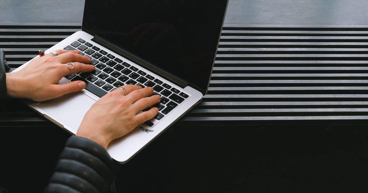 A person attending an online workshop on a laptop about career development.