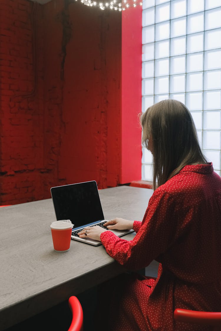 A Woman Using A Laptop