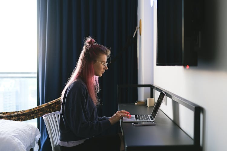 A Woman Using A Laptop