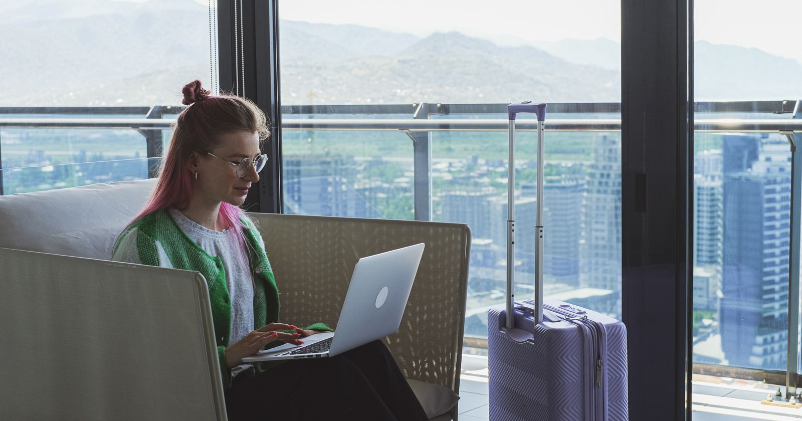 Comparing hotel prices across booking sites on a laptop