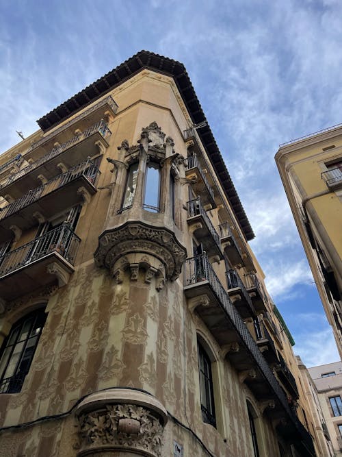 Low Angle Photography of Brown Concrete Building Under Blue Sky