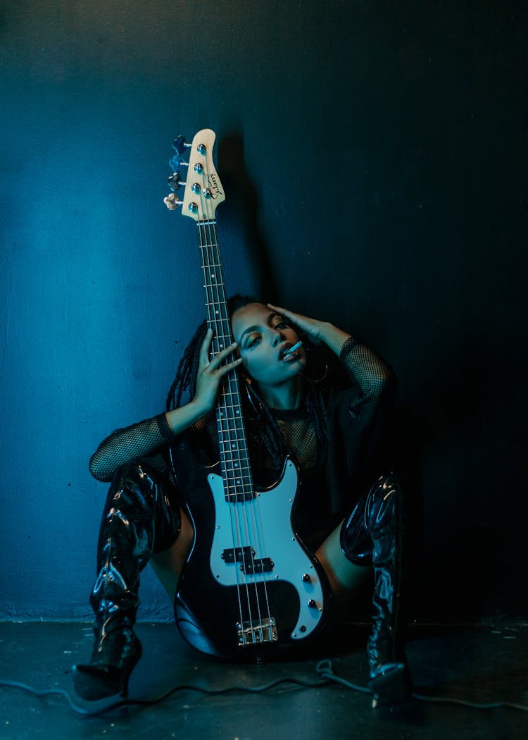 Portrait Of A Woman With An Electric Guitar
