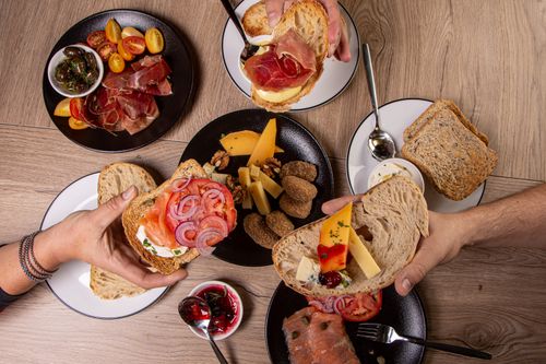 Free Delicious breakfast display with artisan breads and various gourmet toppings. Stock Photo