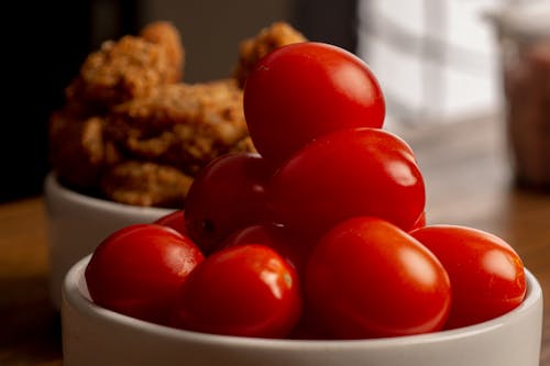 A  Red Cherry Tomatoes on a Ceramic Bowl
