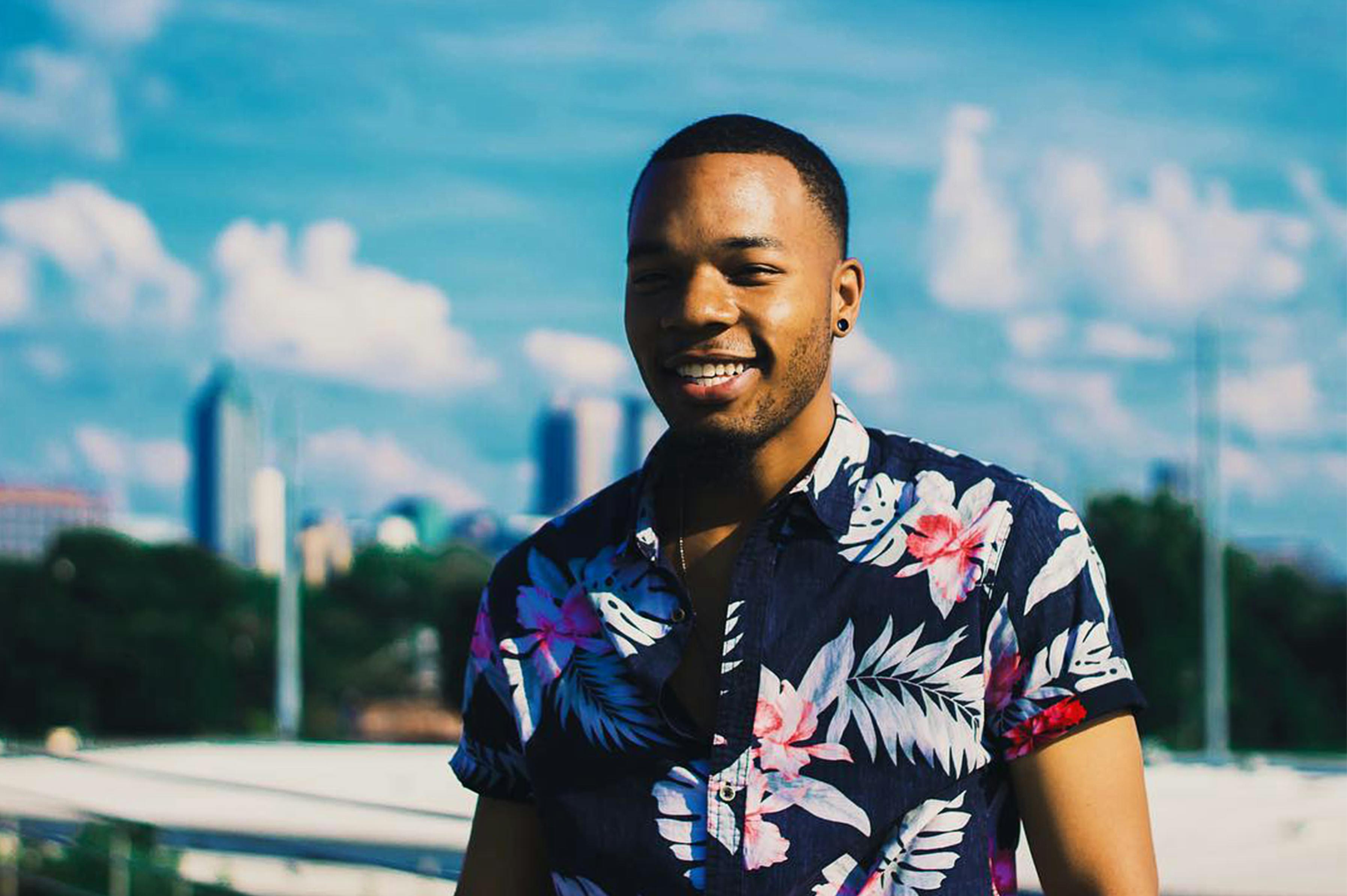 man wearing a floral top