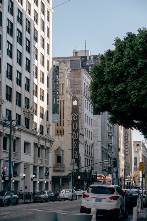 Free A vibrant street scene featuring Tower Theatre in downtown Los Angeles, capturing urban architecture and bustling city life. Stock Photo