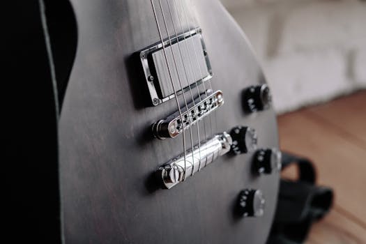 Close-Up Photo of Black Electric Guitar