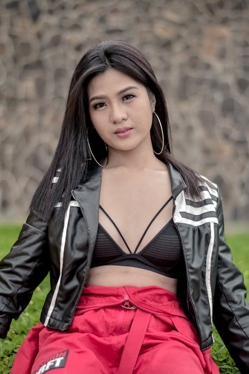 Beautiful Woman in Black Leather Jacket Wearing Hoop Earrings