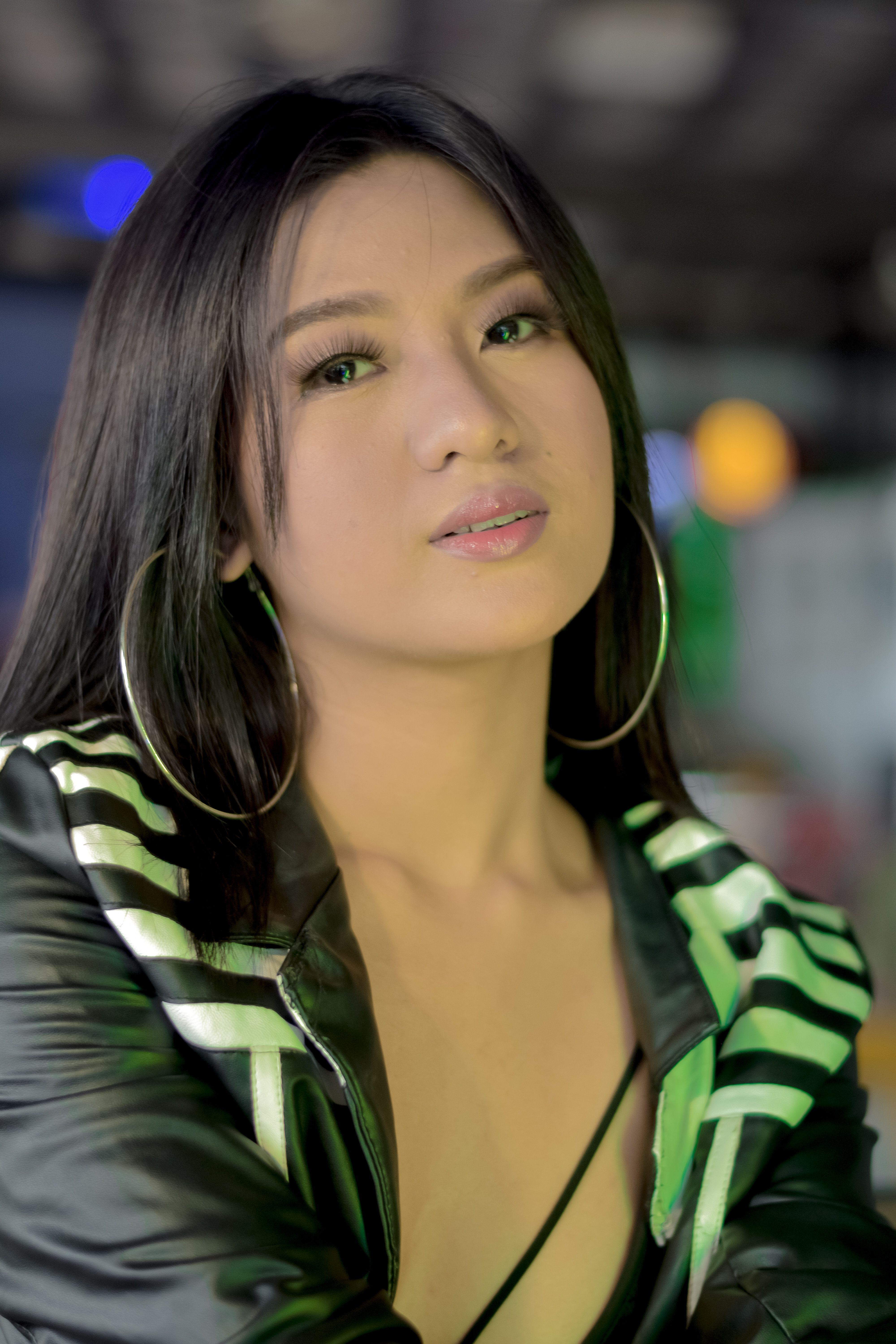 Close-Up Shot of a Beautiful Woman in Black Leather Jacket Wearing Hoop ...