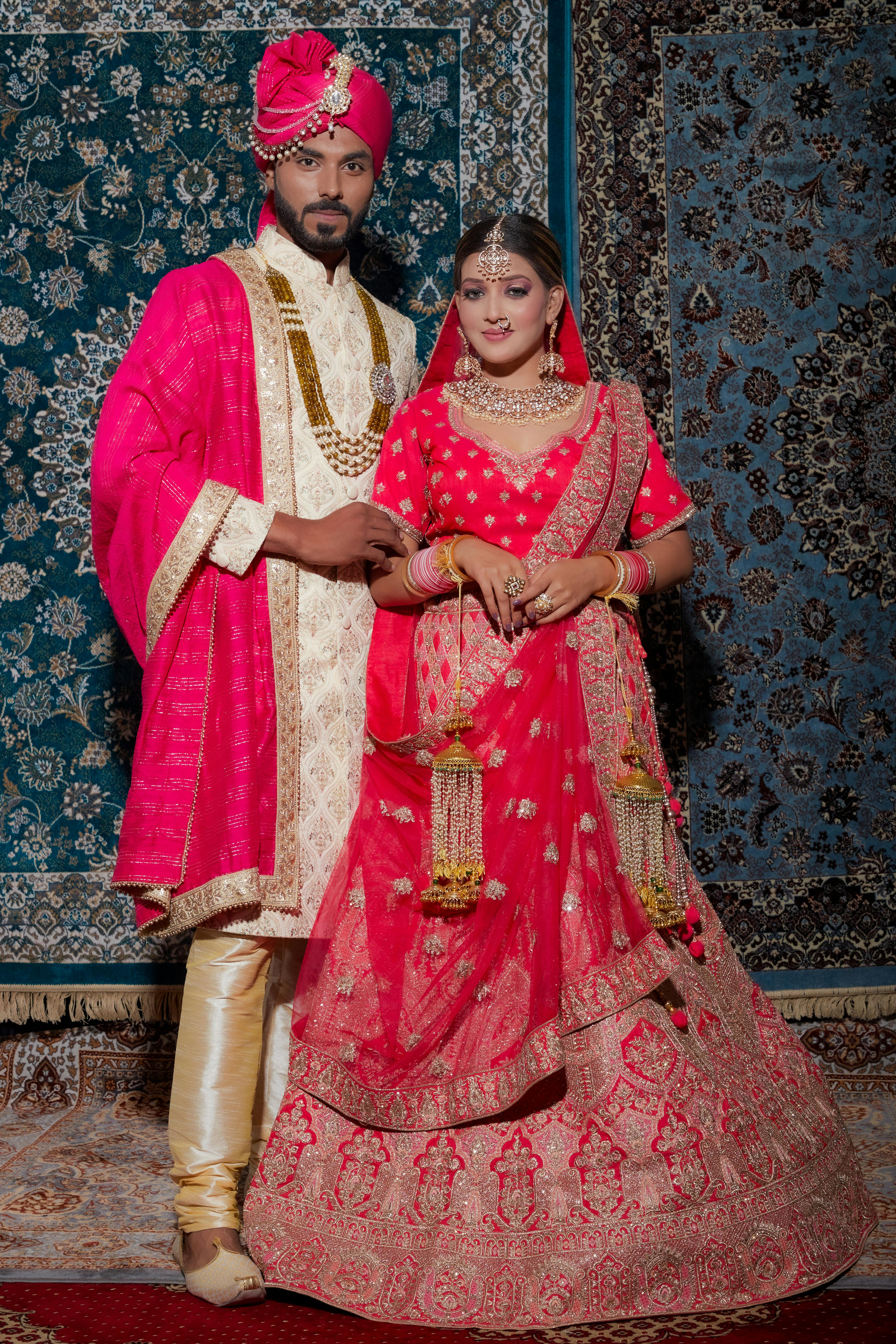 Indian couple posing at their reception stage. | Photo 98602