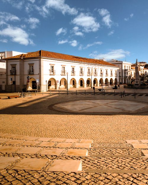 Free Beautiful view of the historic city square and municipal building in Tavira, Portugal, under clear skies. Stock Photo