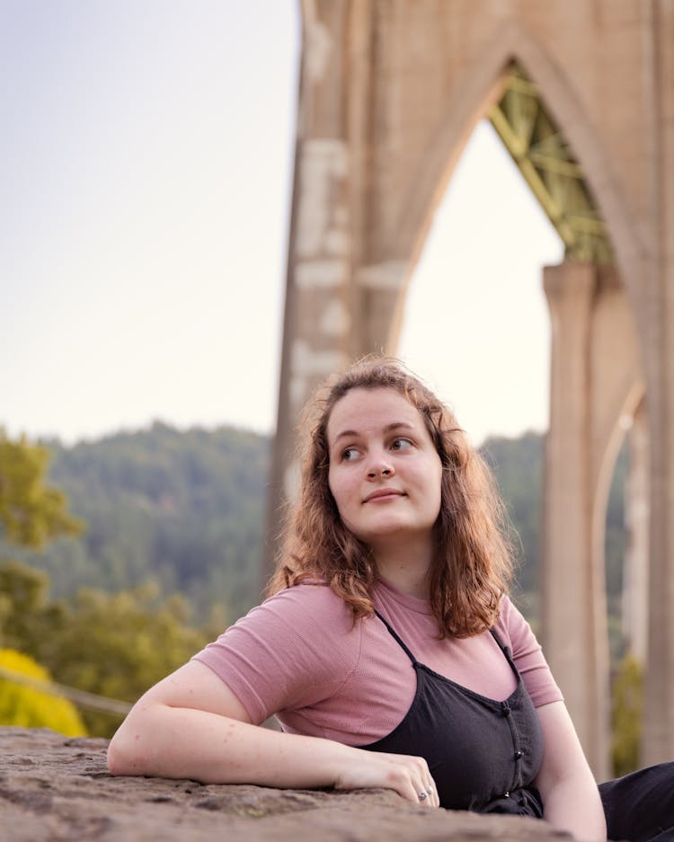 Woman Resting Arm On Rock