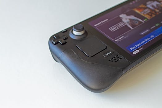 Detailed view of a handheld gaming console showcasing game selection on its screen.