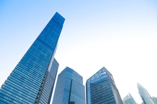 Majestic skyscrapers against a clear blue sky, showcasing urban architecture.