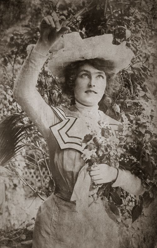 Free Black and white portrait of a woman holding a bouquet, dressed in vintage attire, evoking a retro feel. Stock Photo