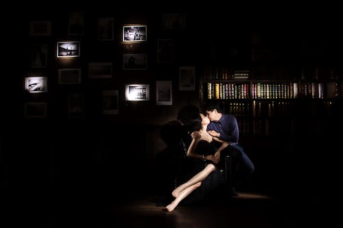 A Couple Kissing in the Dark