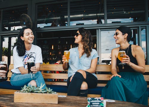 Three Women Sitting on Bench