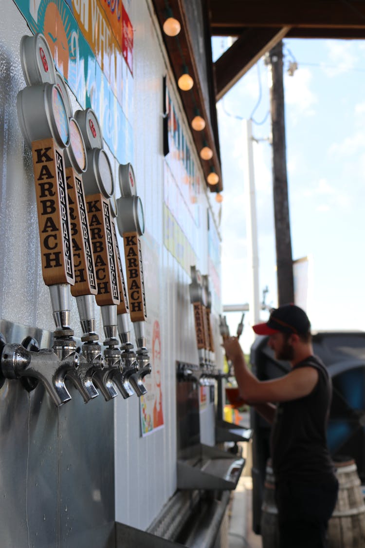 Man Holding Beer Tap