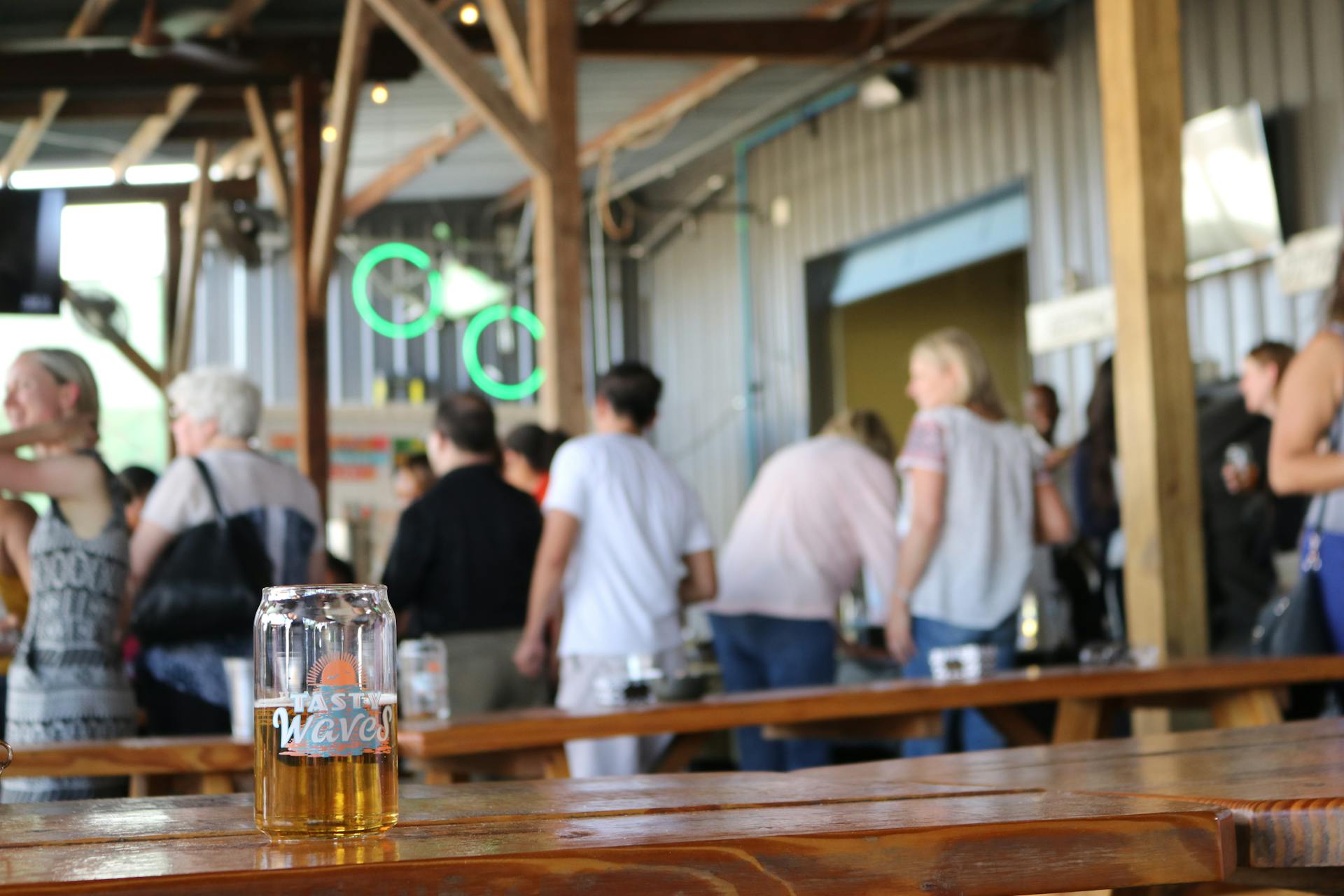 Selective Photography of Clear Beer Glass on Top of Brown Wooden Table