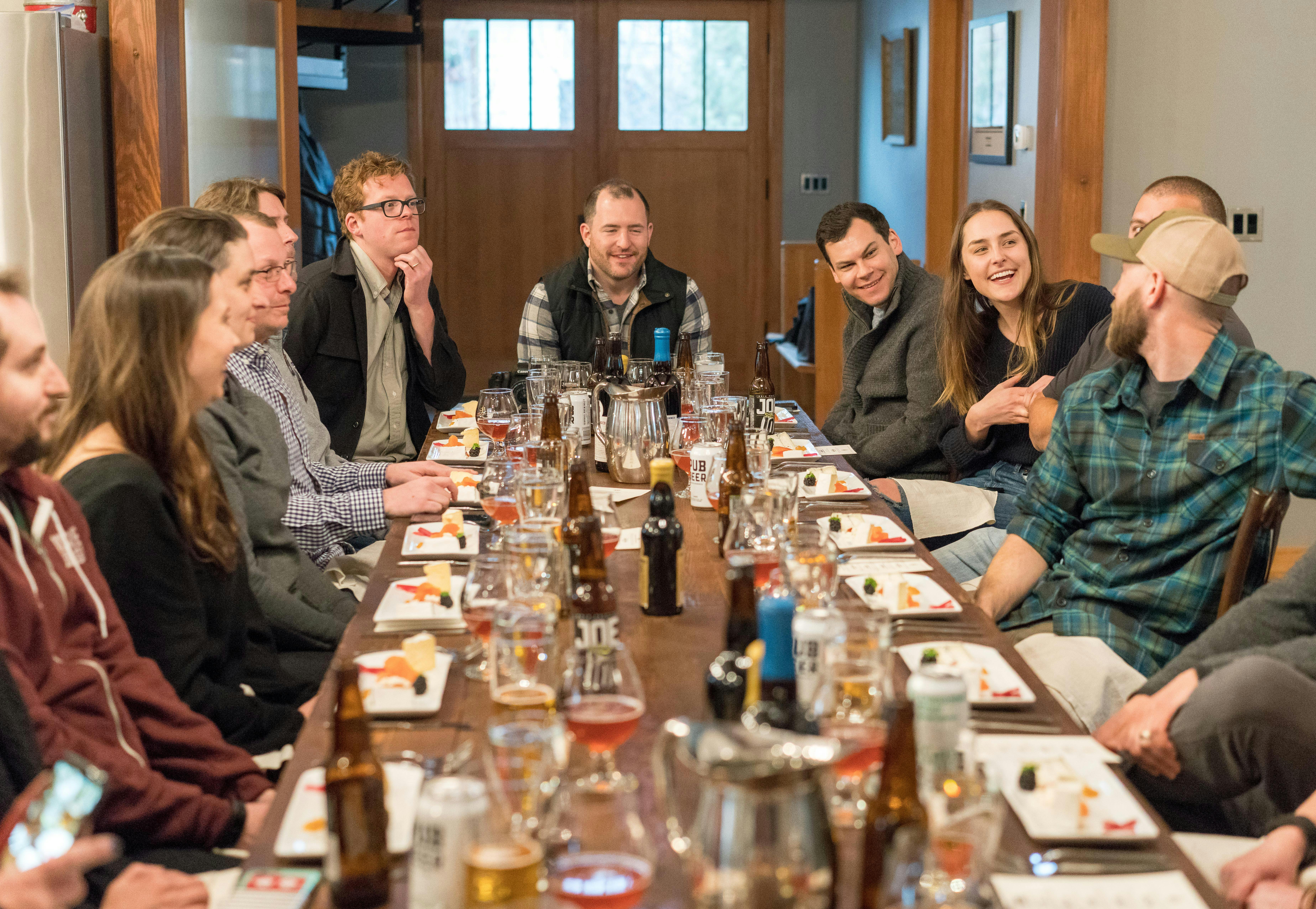 group of people sitting on dining table