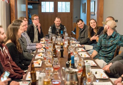 Group of people sitting at a dining table