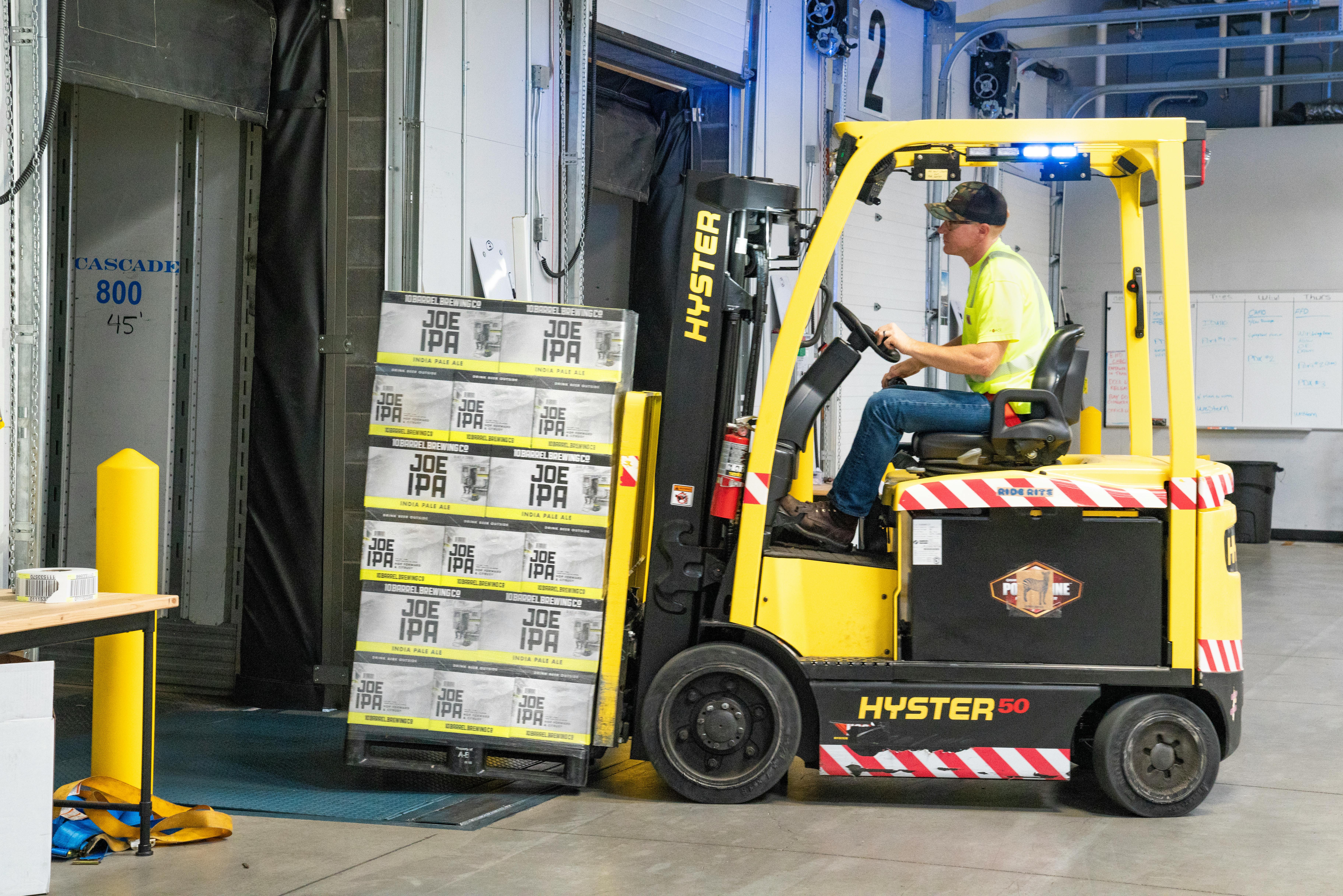 Download Man Riding A Yellow Forklift With Boxes Free Stock Photo Yellowimages Mockups