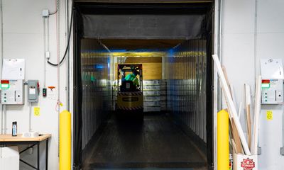 Forklift at warehouse loading dock entrance