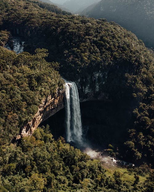 Aerial Shot of Mountain Landscape with Waterfall