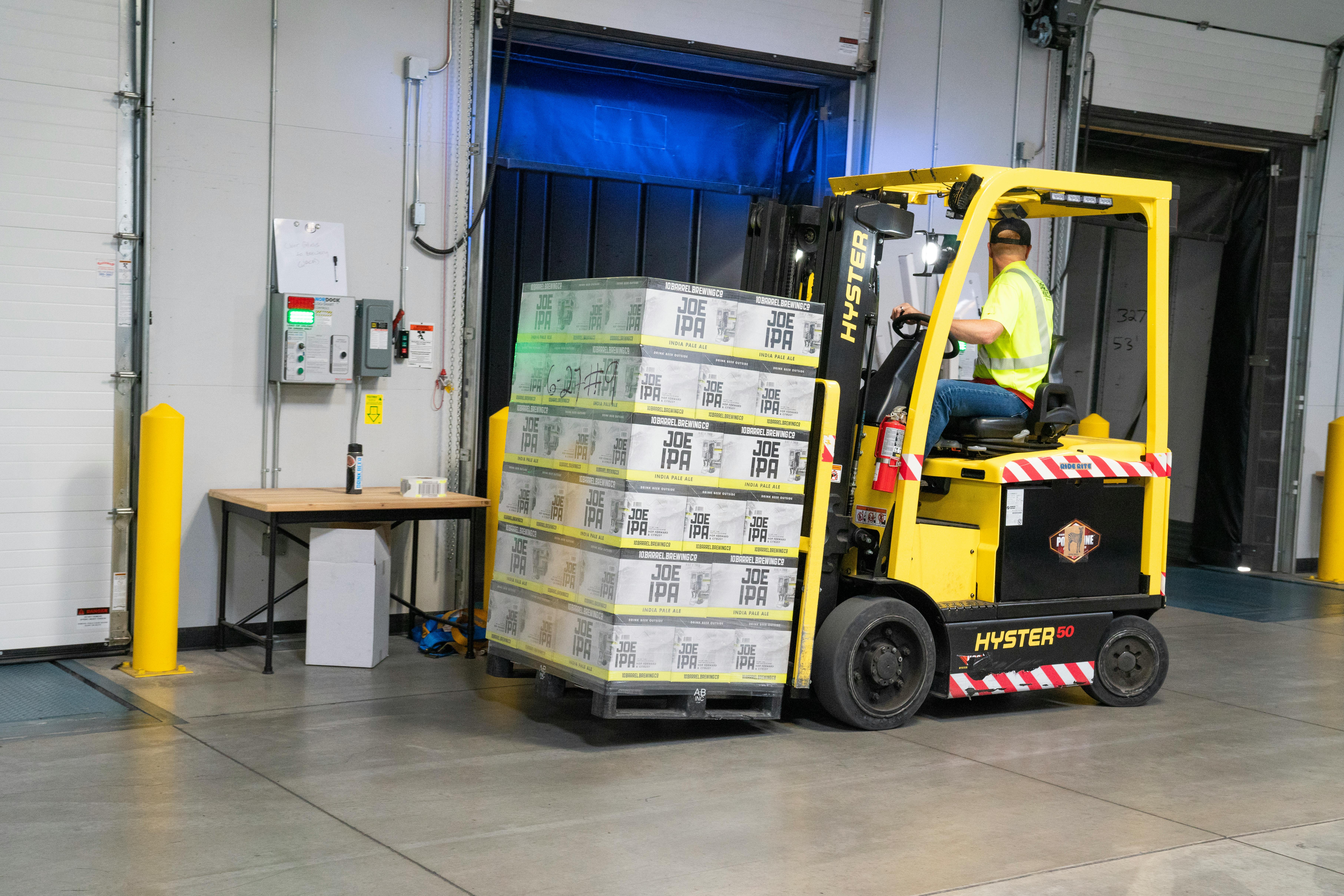 Man Riding on Yellow Forklift