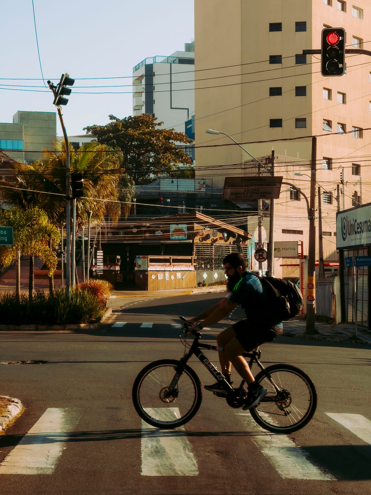 Cyclist riding along a modern road with a helmet and protective equipment