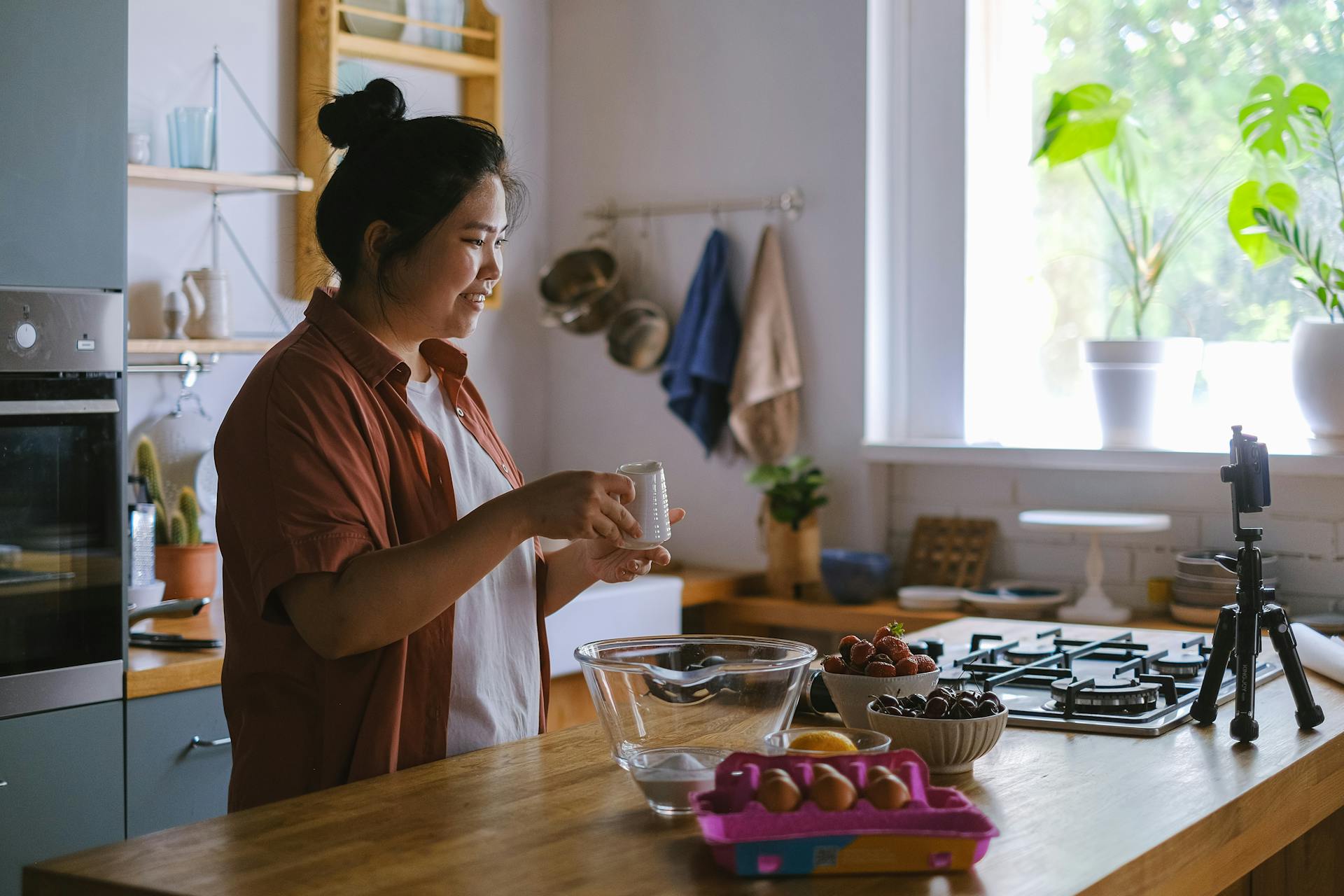 A Woman Doing Food Blogging while in the Kitchen