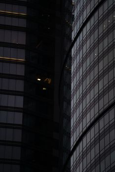 Low-angle view of a sleek skyscraper's glass facade in Mexico City highlighting modern architecture.