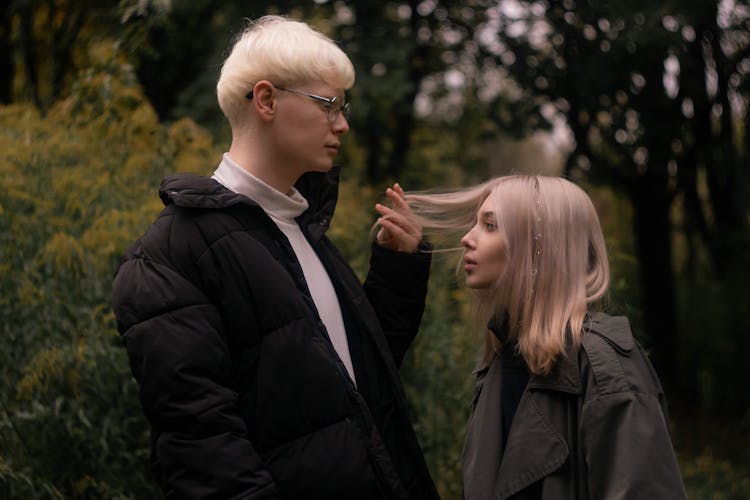 Portrait Of Blonde Ethereal Couple In Park