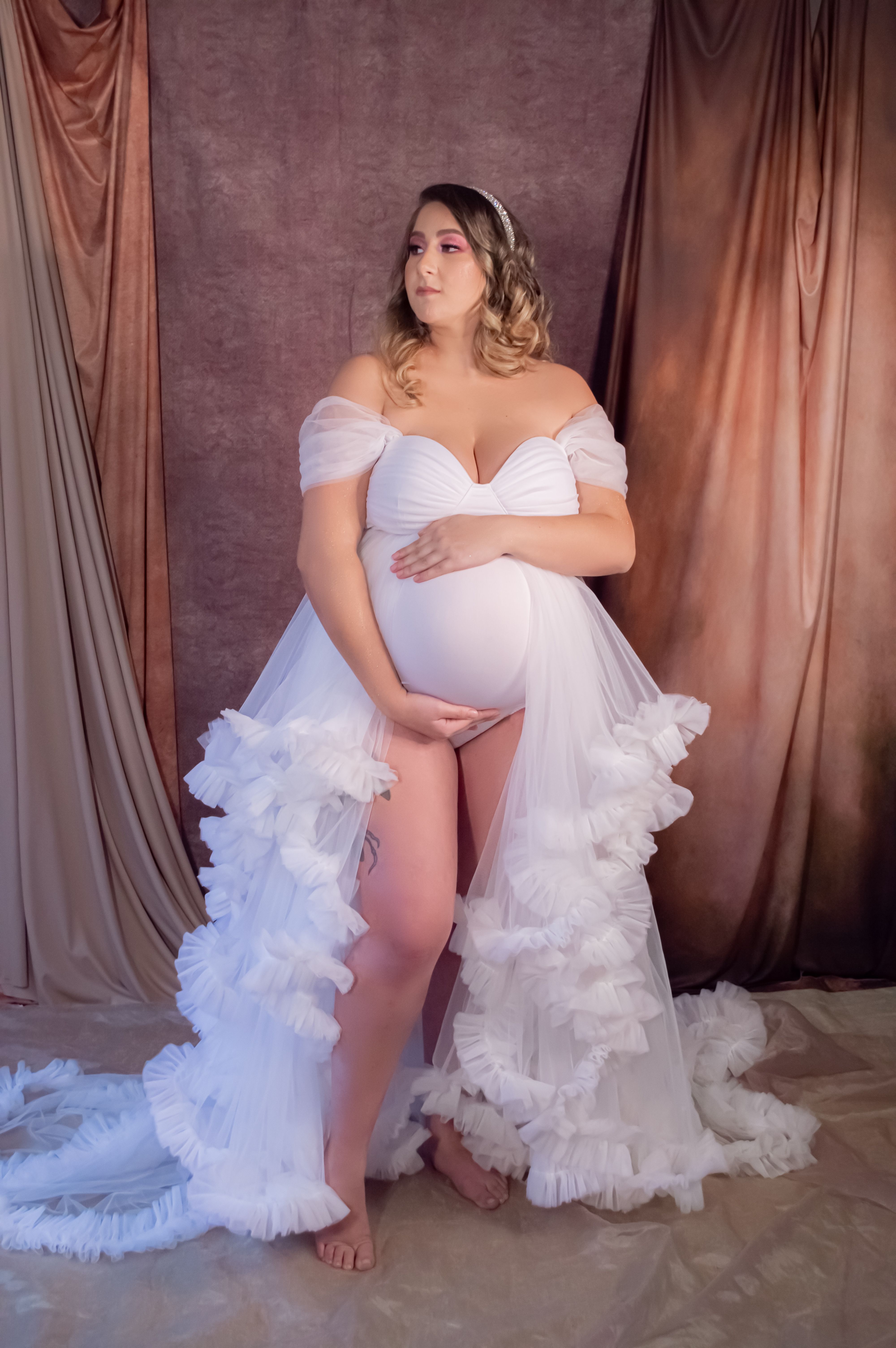 pregnant woman in white dress a smiles happily. photo  Free Woman Image on Unsplash sheer short bell sleeves and back Pregnant Woman White Dress Looking