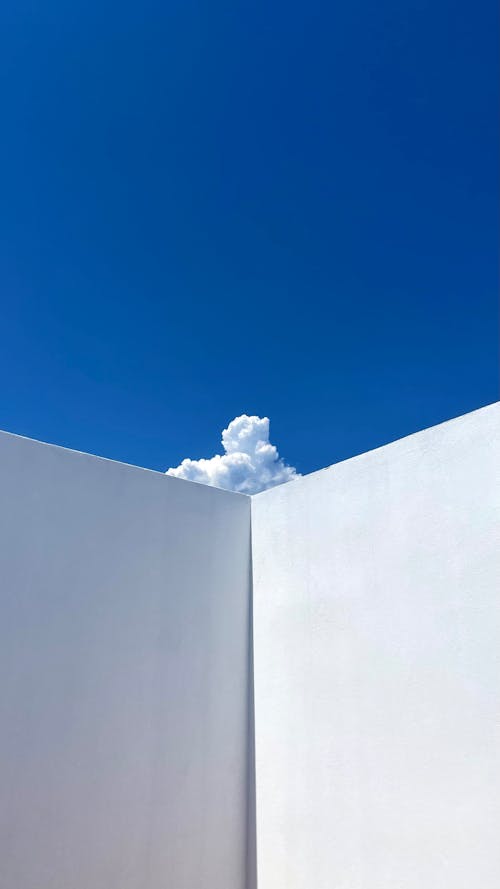 Free Cloud Behind White Wall Corner Stock Photo