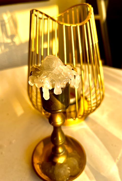 A Melted Candle on a Candle Holder