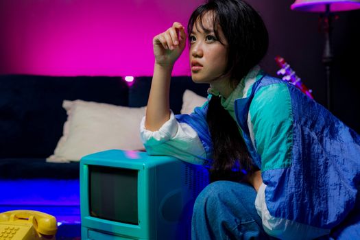 Portrait of a woman in retro style with neon lighting and vintage television, evoking the 90s era.