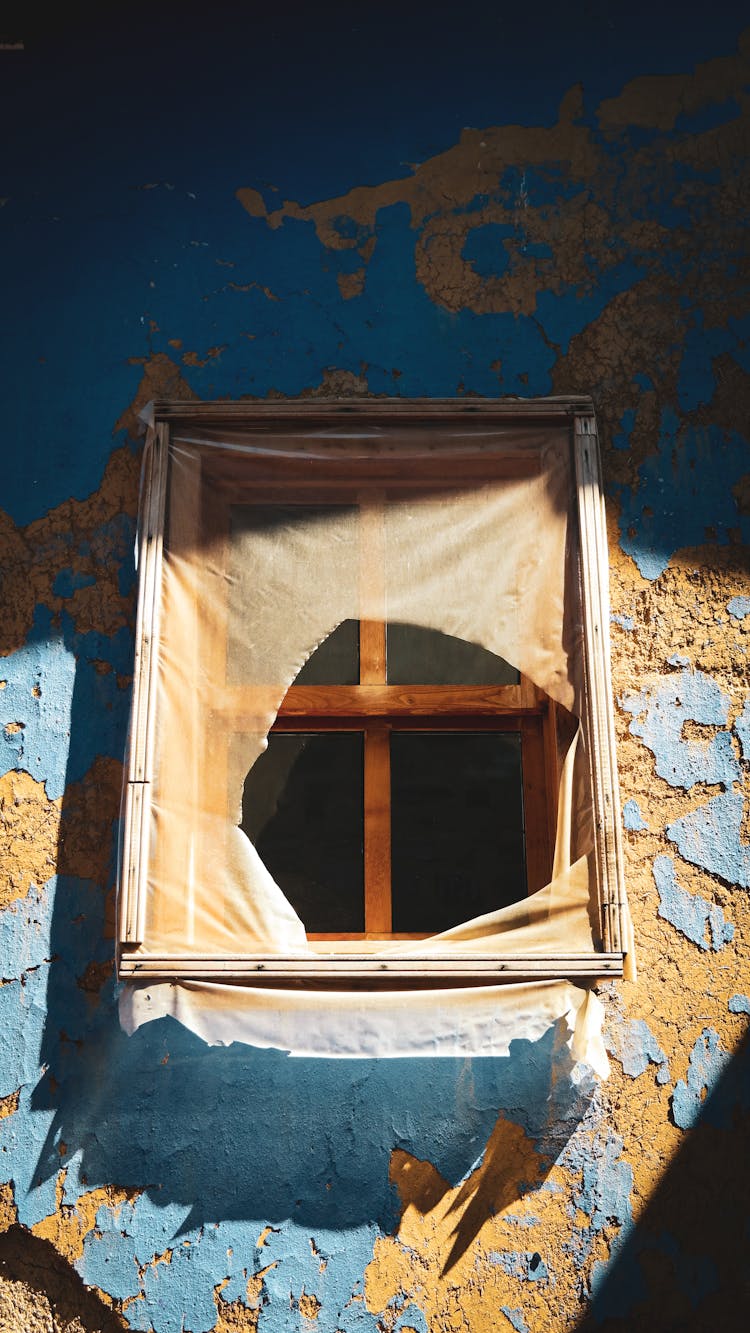 Thin Cloth Covering The Wooden Framed Window 