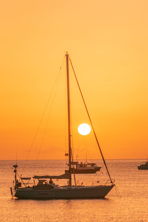 Yacht on Sea Against Sunset