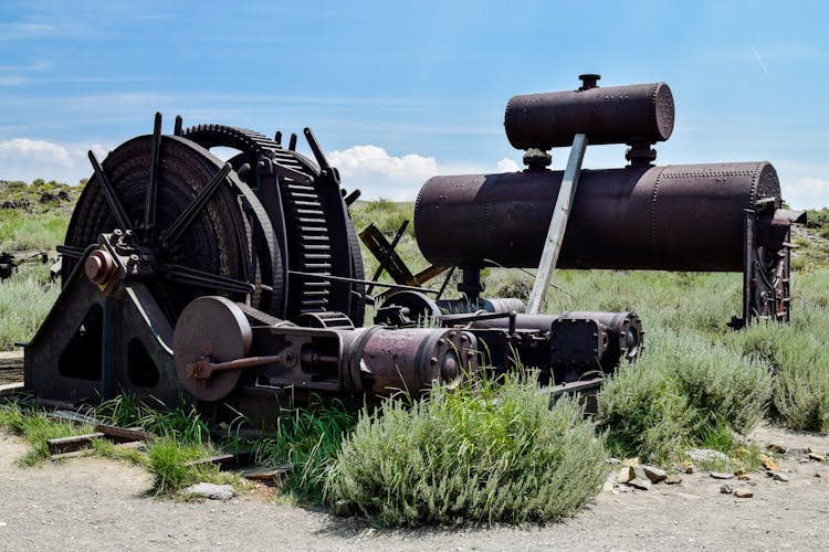 Old Rusted Machines On Green Grass