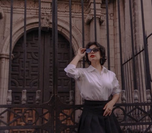 Woman Wearing Sunglasses to Shirt and Skirt